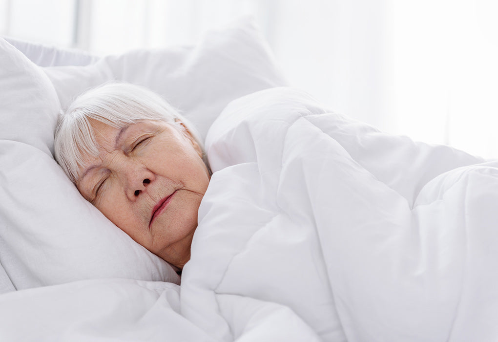 Med Air Solutions filterless UV air purifier- woman sleeping in bed